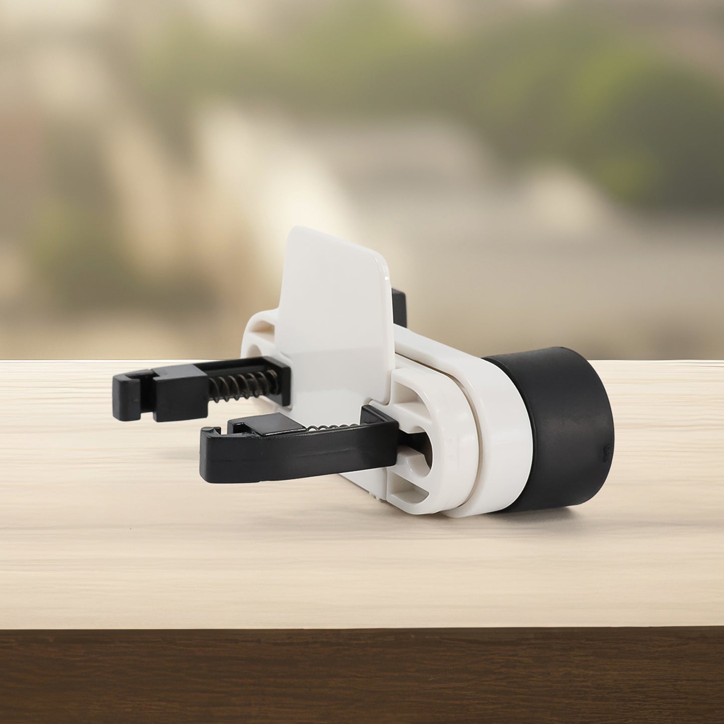 Wukusy automotive car phone holder with 180-degree rotating mount, securely holding smartphone inside vehicle.
