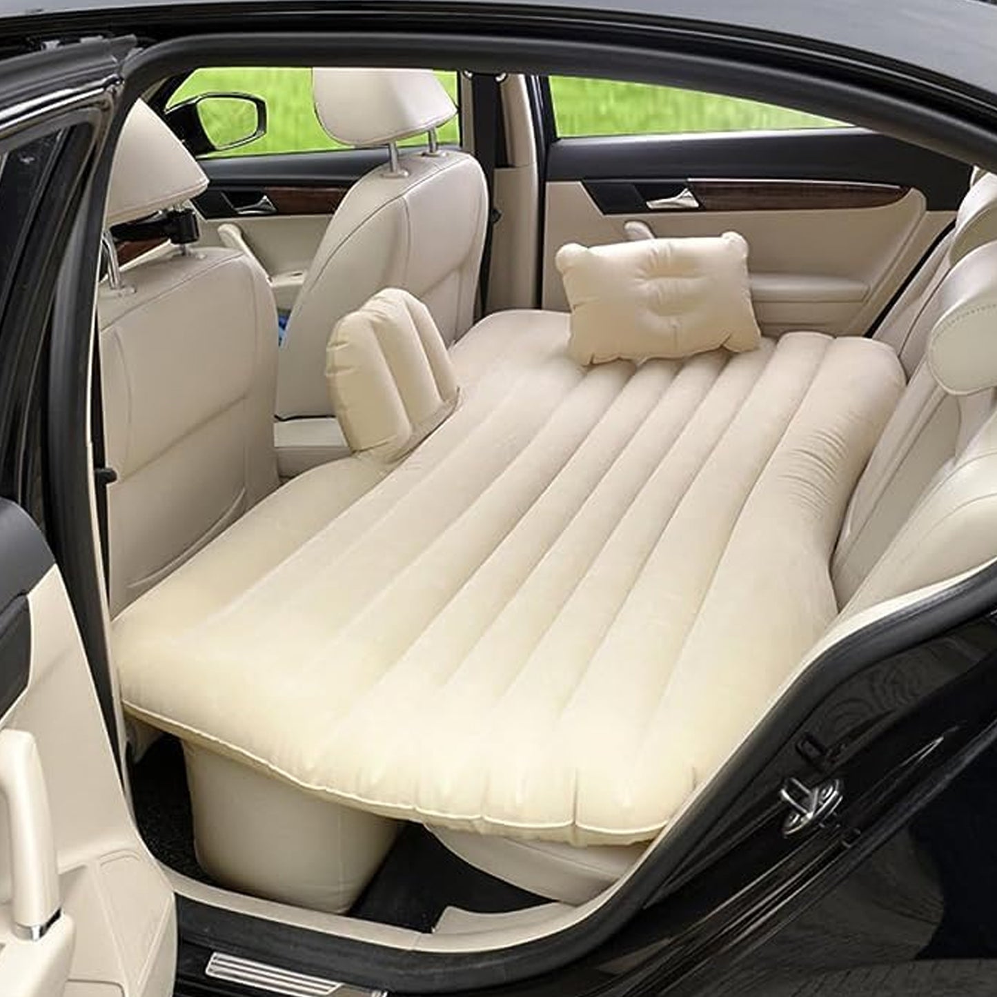 Wukusy portable car backseat inflatable air mattress bed spread out inside a vehicle for comfort and rest during travel.