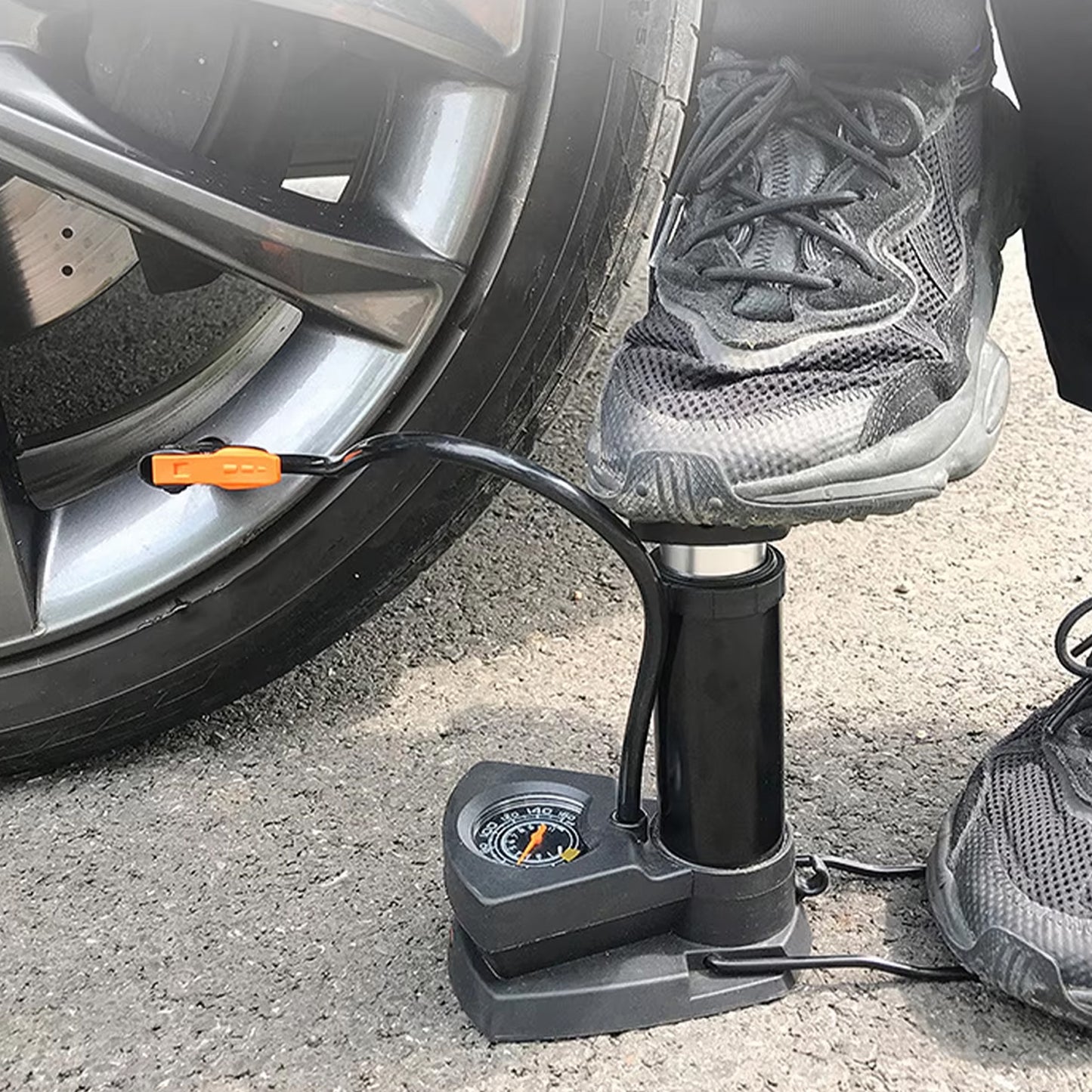 Wukusy portable mini bike pump with foot-operated mechanism, compact automotive cycle pump for inflating bicycle tires.