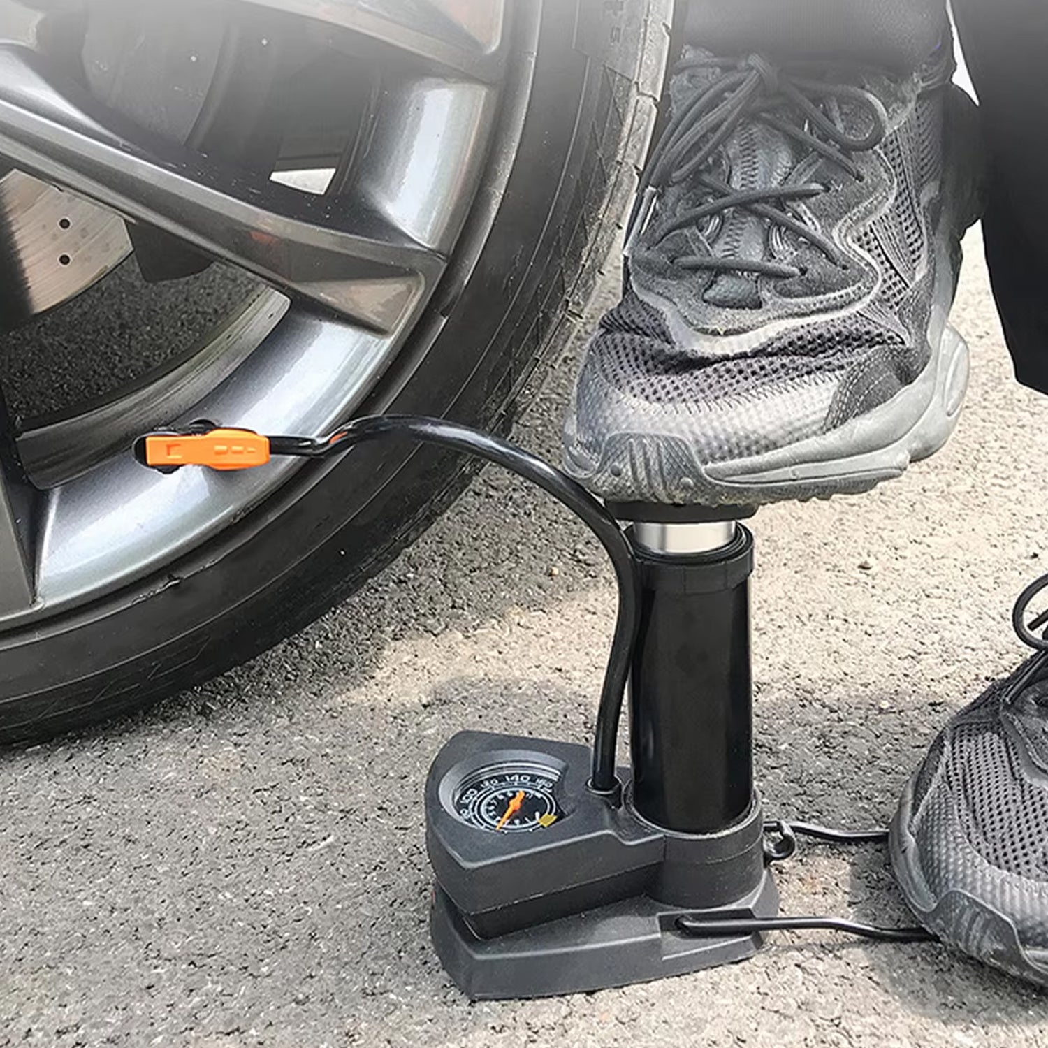 Wukusy portable mini bike pump with foot-operated mechanism, compact automotive cycle pump for inflating bicycle tires.