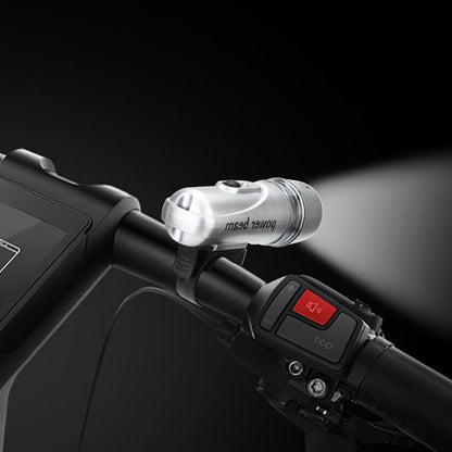 Wukusy Power Beam LED bicycle headlight mounted on a bike, providing bright illumination for night riding.