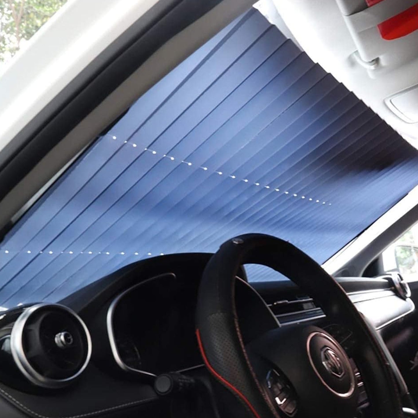 Wukusy retractable long foldable windshield sun shade for car, showing the sunshade extended inside a vehicle for sun protection.