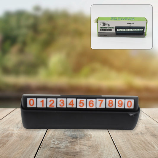 Wukusy temporary car parking mobile number display with magnetic number stickers attached to a vehicle for easy visibility.