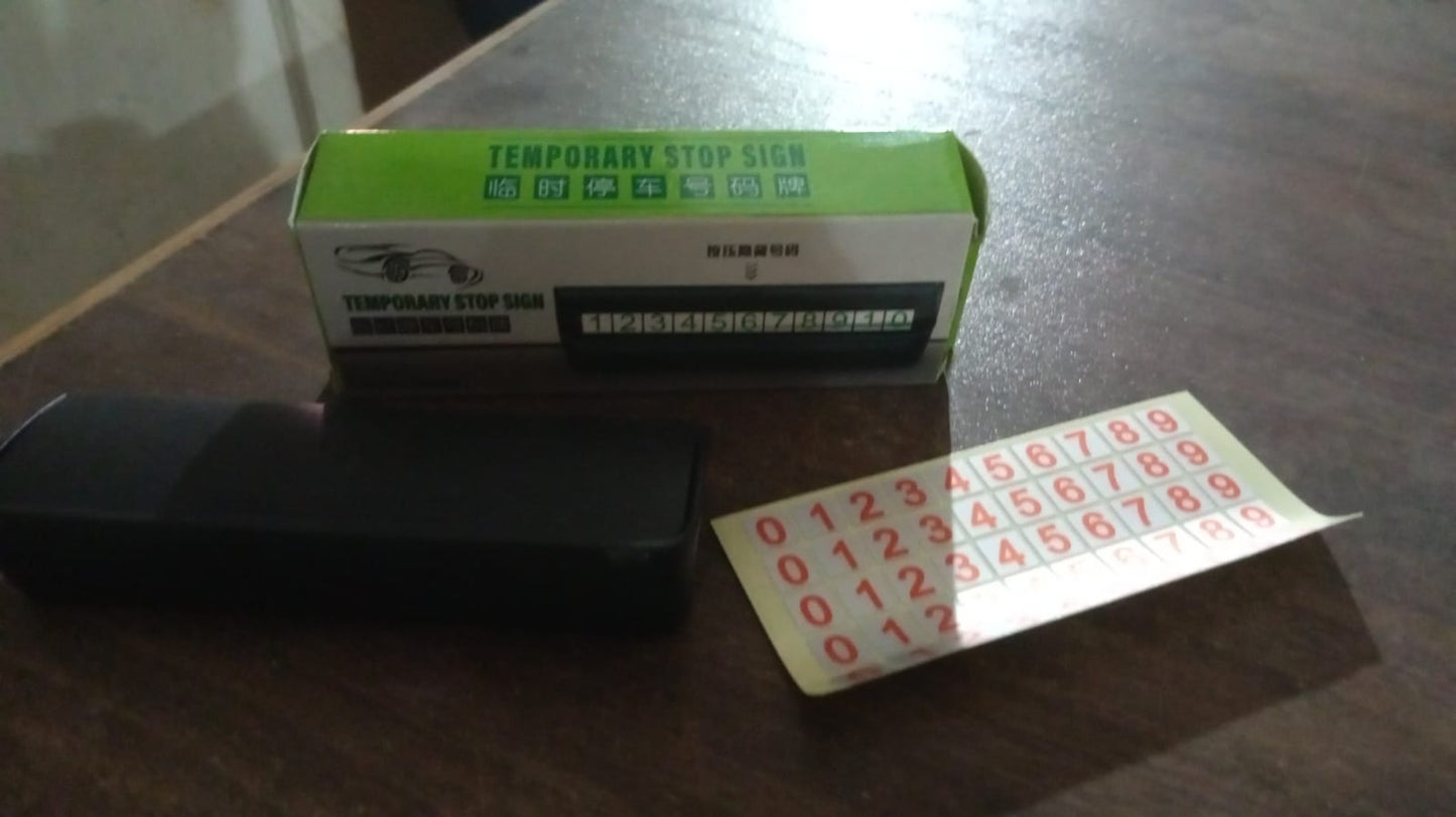 Wukusy temporary car parking mobile number display with magnetic number stickers attached to a vehicle for easy identification.