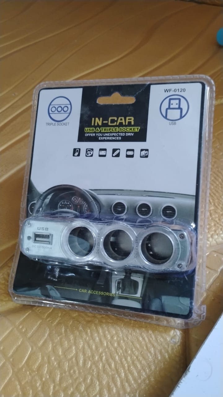 Wukusy automotive triple 3-way car 12V lighter socket splitter with USB charger ports, mounted inside a vehicle.