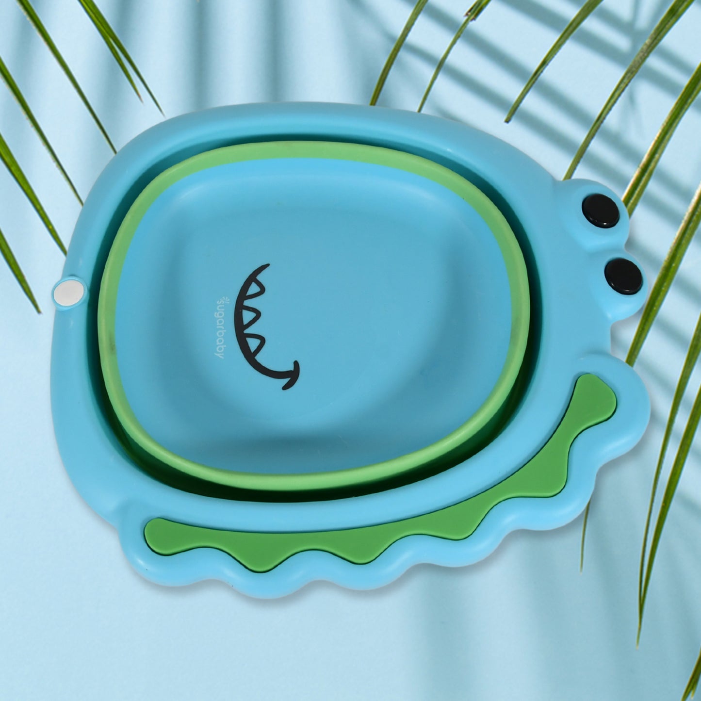 Foldable frog-shaped baby wash basin by Wukusy, lightweight, space-saving, thick plastic, ideal for face washing at home.