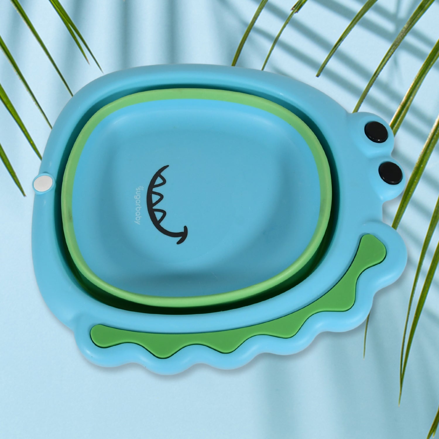 Foldable frog-shaped baby wash basin by Wukusy, lightweight, space-saving, thick plastic, ideal for face washing at home.