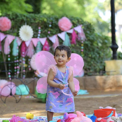 Baby girl wearing colorful nylon fairy wings costume with angel wing wand and hairband for party, by Wukusy.
