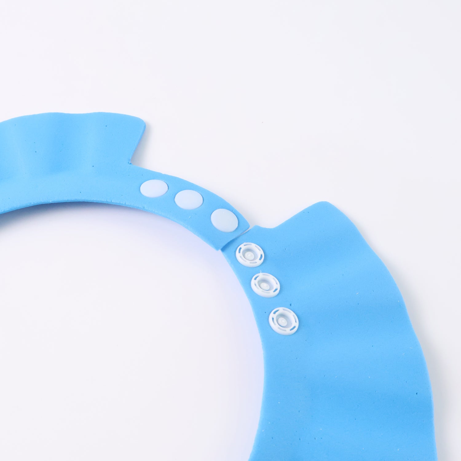 Adjustable Wukusy Baby Shower Cap for baby care, featuring a soft, waterproof design in a neutral color.
