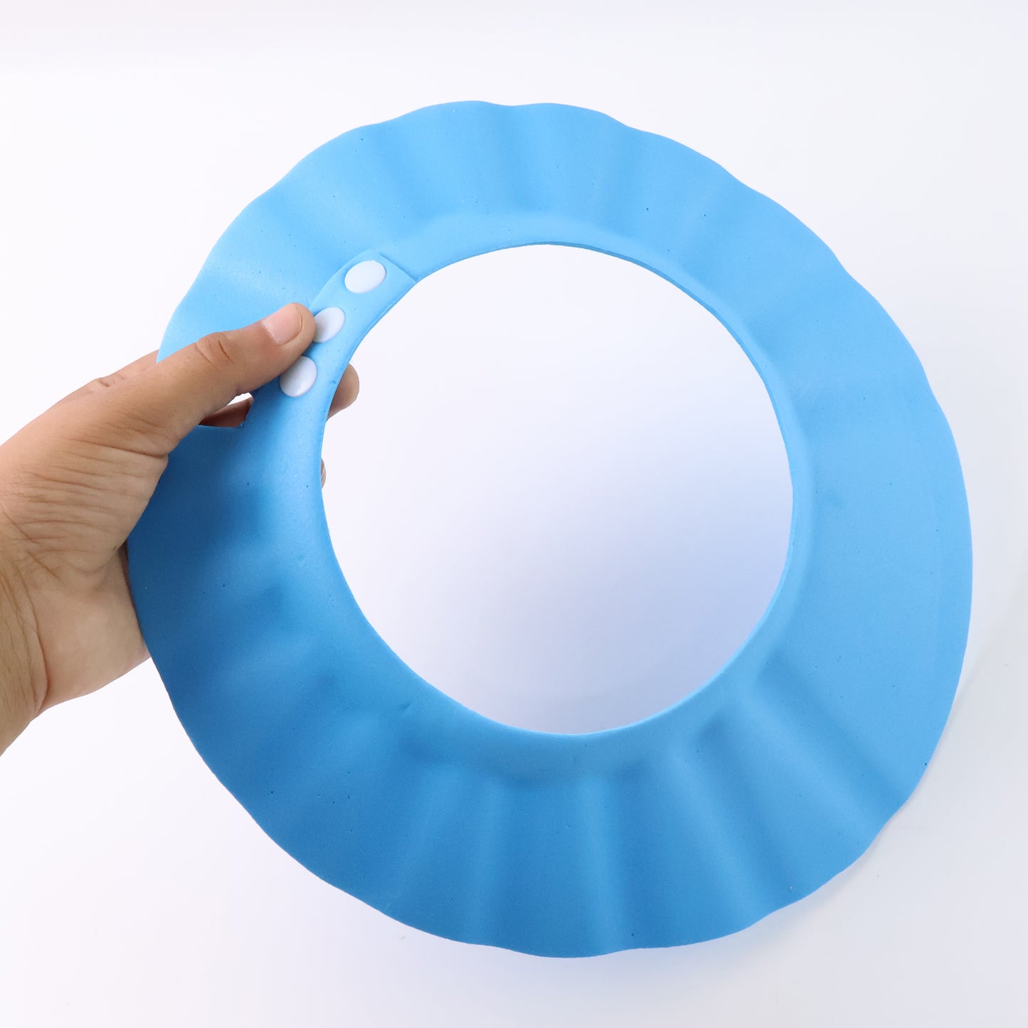 Adjustable Wukusy baby shower cap for babies, made of soft waterproof material, designed to keep baby’s hair dry during bath time.