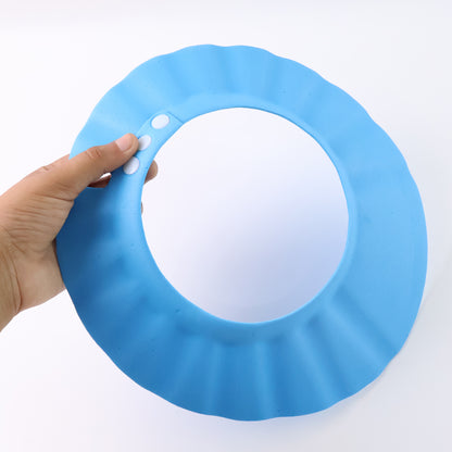 Adjustable Wukusy baby shower cap for babies, made of soft waterproof material, designed to keep baby’s hair dry during bath time.