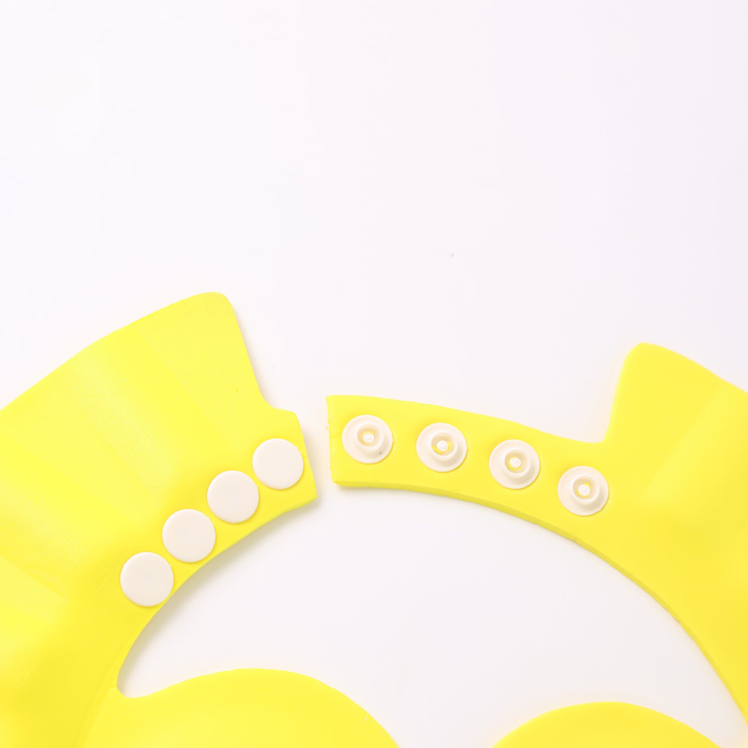 Adjustable baby shower cap by Wukusy, made for keeping baby dry during baths, featuring soft waterproof material and adjustable fit.