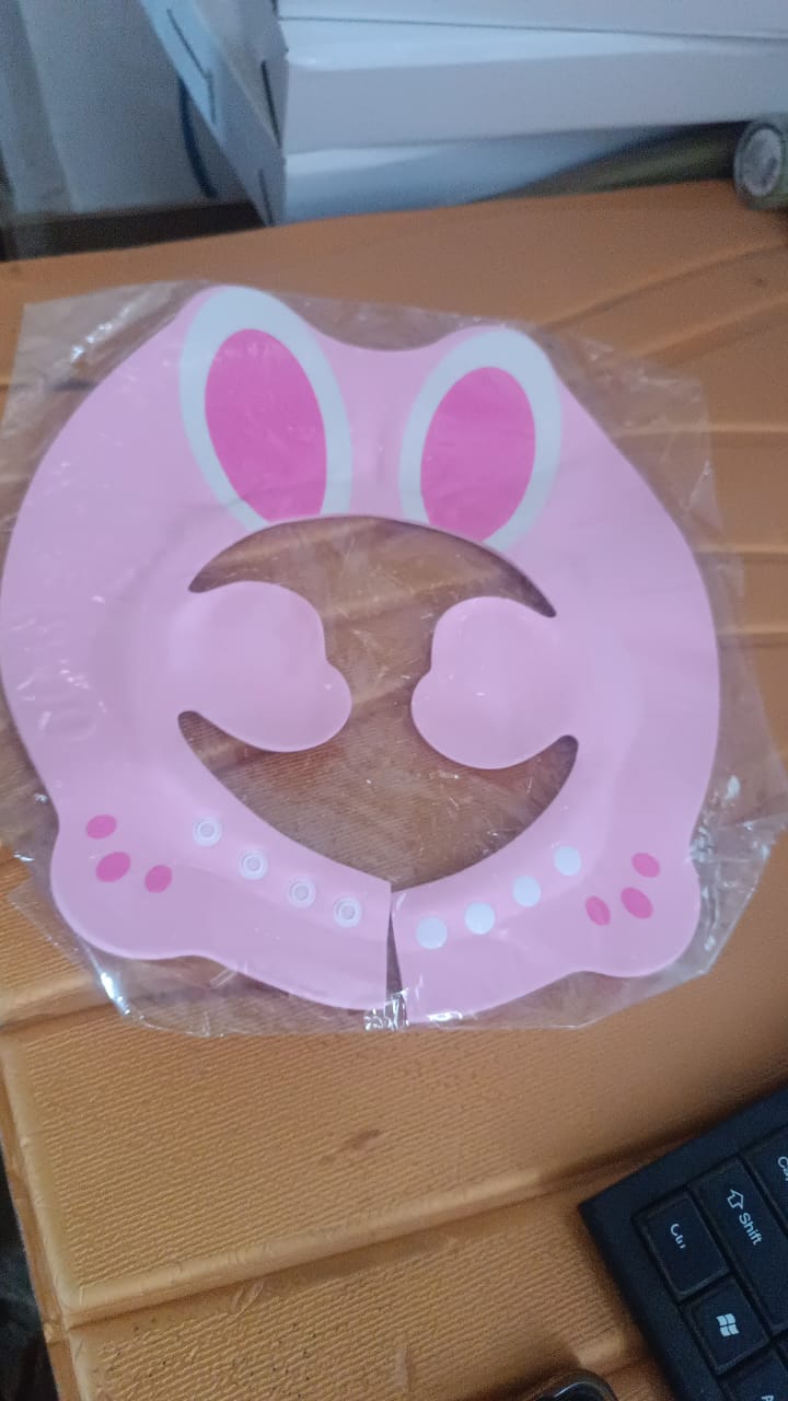 Adjustable Bunny Ear Baby Shower Cap by Wukusy, soft baby care cap with cute bunny ears for newborns and infants.