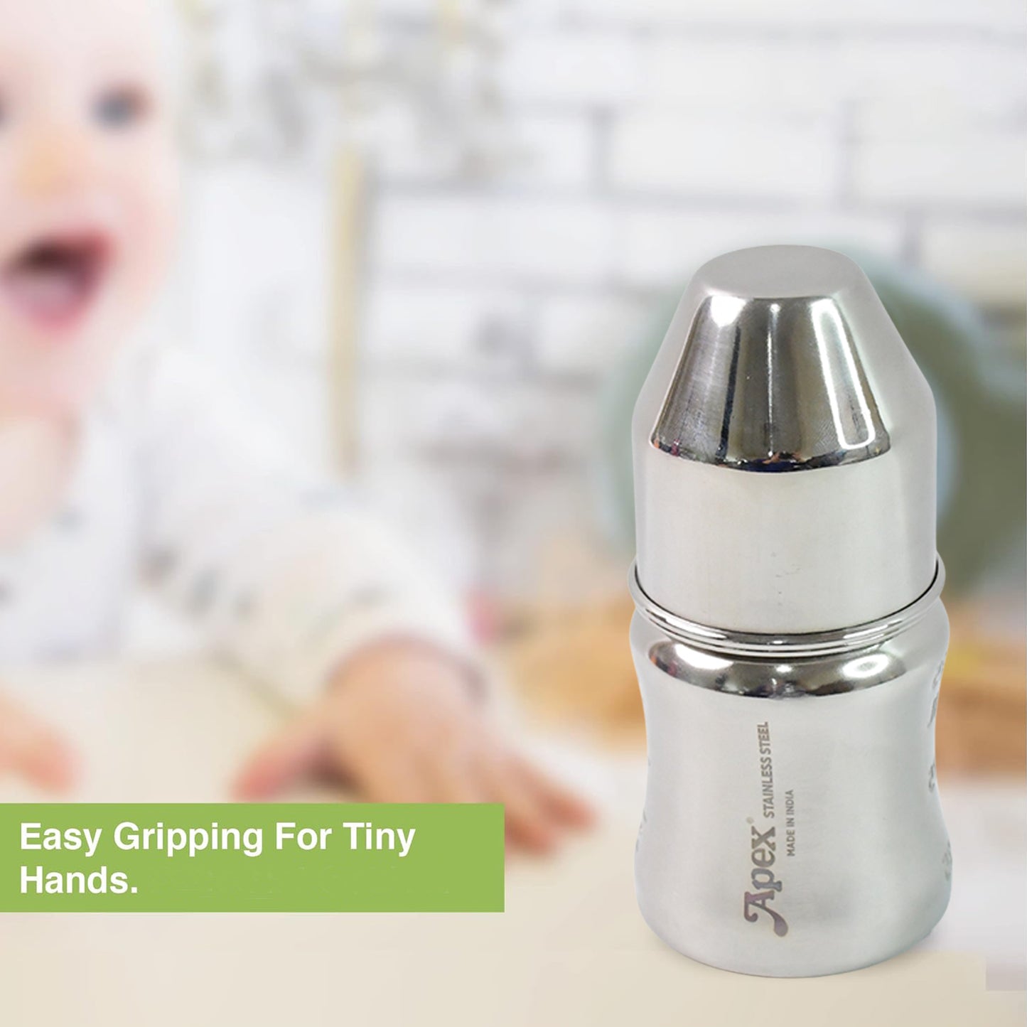 Wukusy Apex Premium stainless steel baby feeding bottle, 125 ml, with soft silicone nipple and leak-proof design.