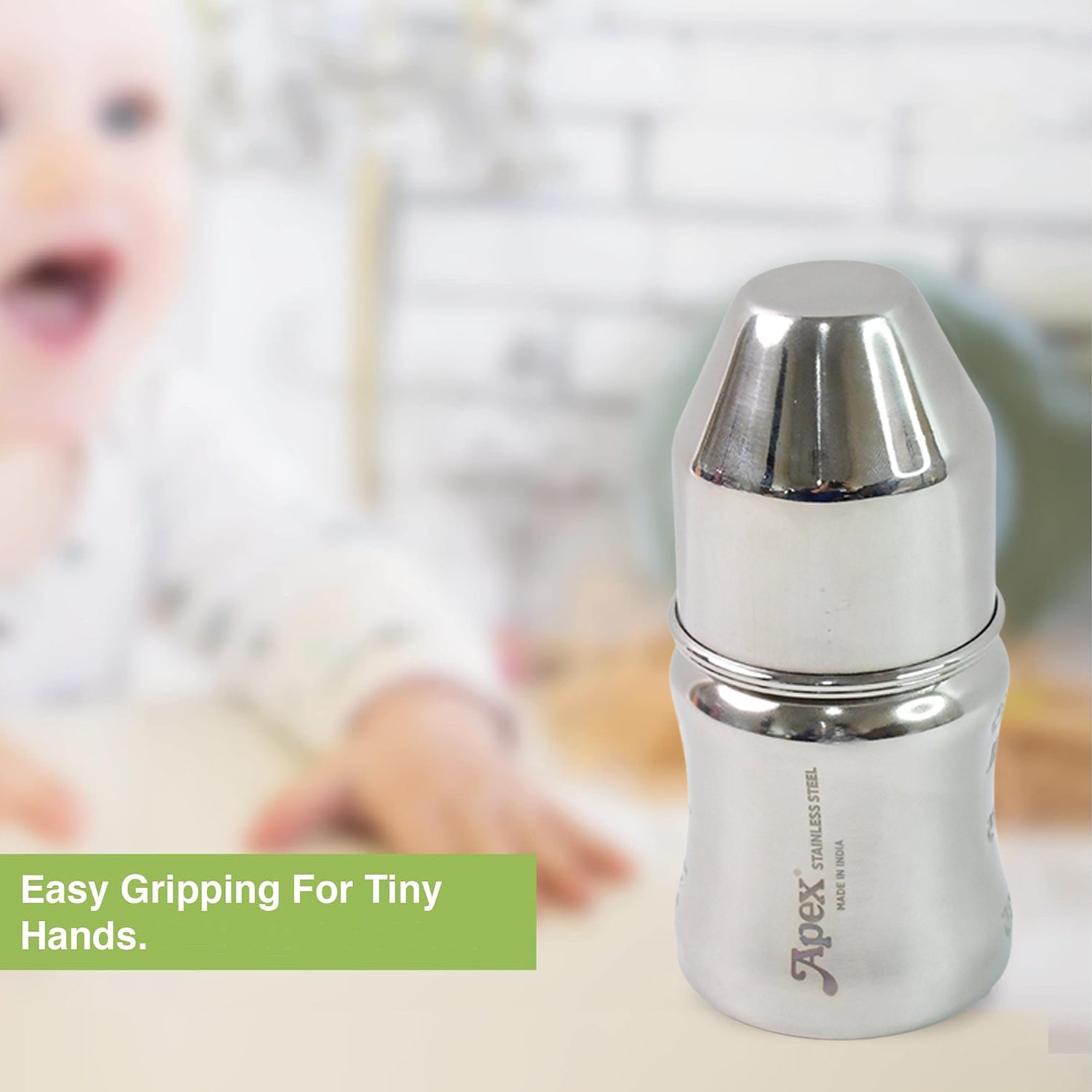 Wukusy Apex Premium stainless steel baby feeding bottle, 125 ml, with soft silicone nipple and leak-proof design.