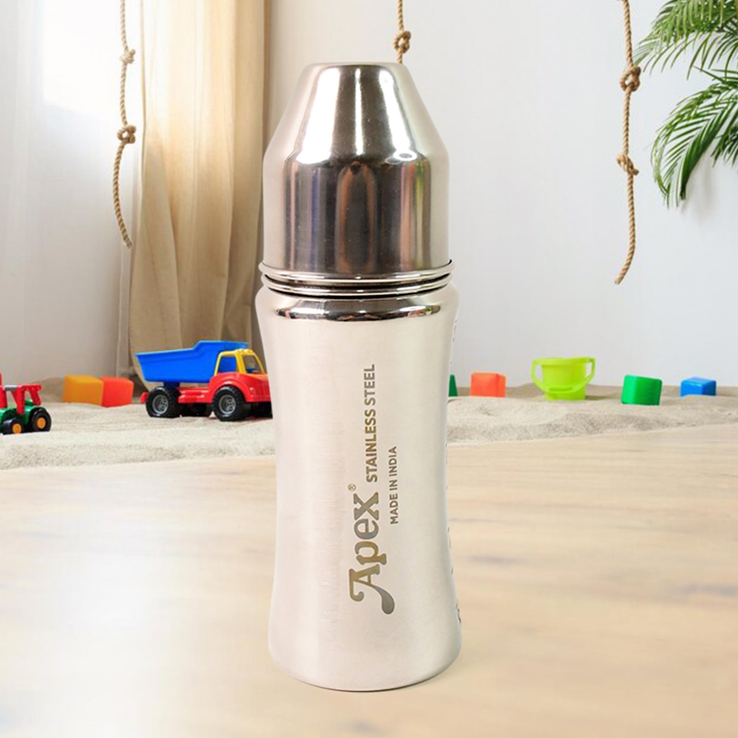 Apex Stainless Steel Little Champ baby feeding bottle by Wukusy, 250 ml, with a clear silicone nipple and stainless steel body.