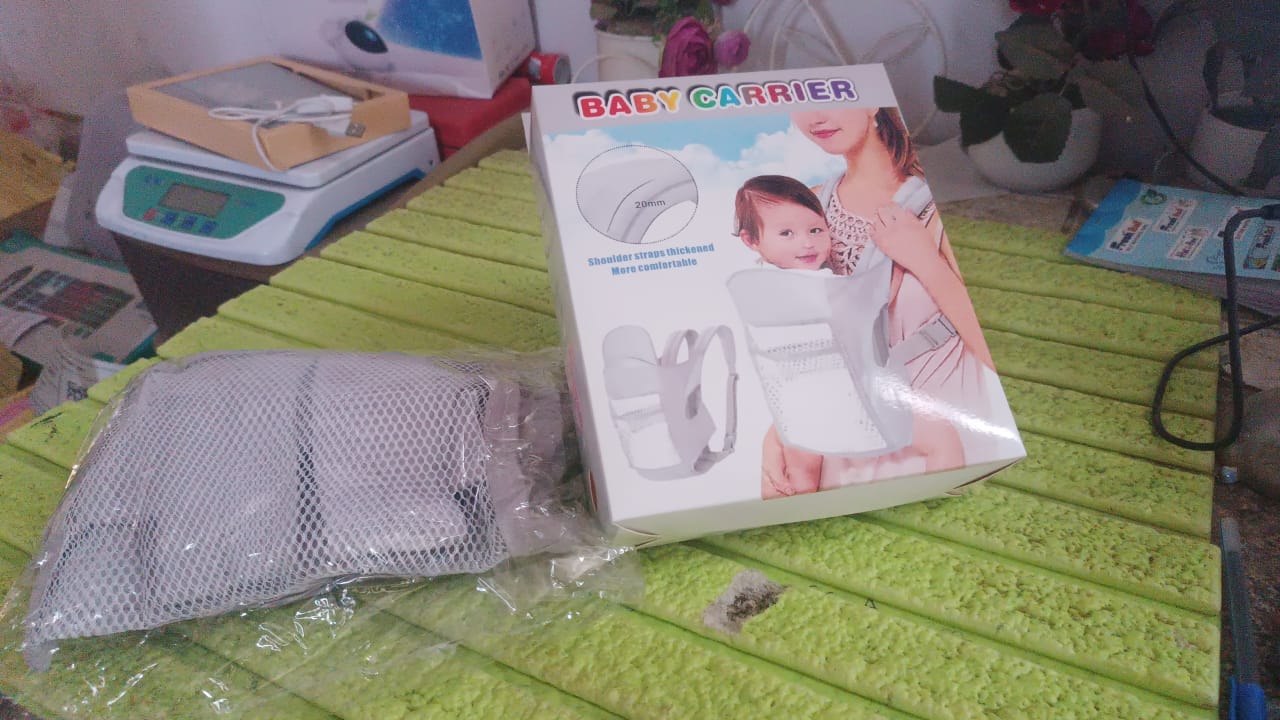 Wukusy ergonomic baby carrier bag showing adjustable straps and breathable fabric for comfortable baby holding and carrying.