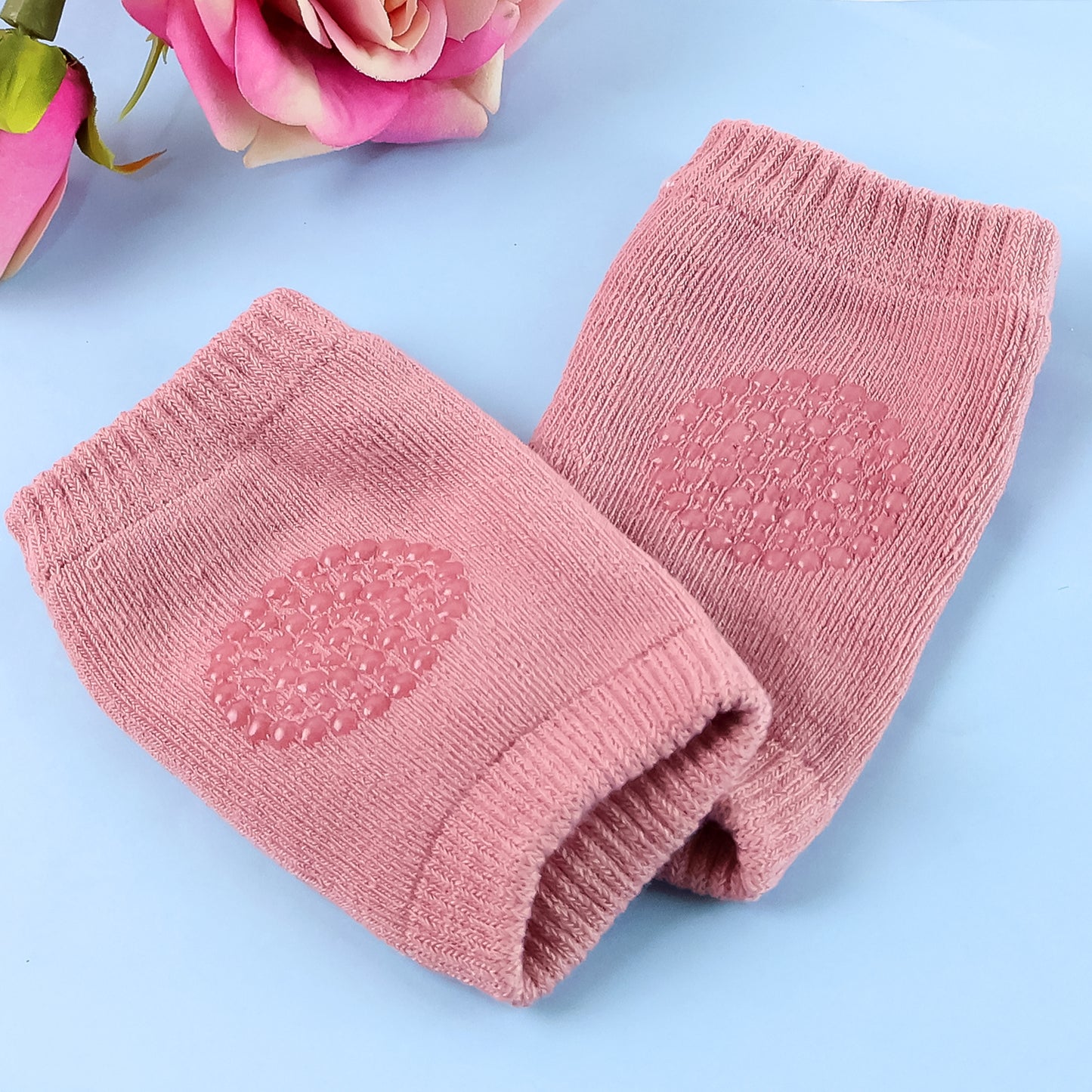 Pink toddler wool knit leg warmer and knee guard by Wukusy, soft baby care accessory for warmth and protection.