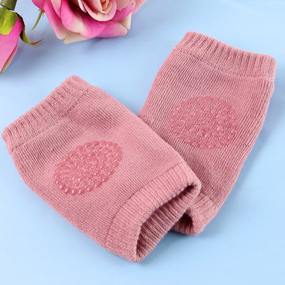 Pink toddler wool knit leg warmer and knee guard by Wukusy, soft baby care accessory for warmth and protection.