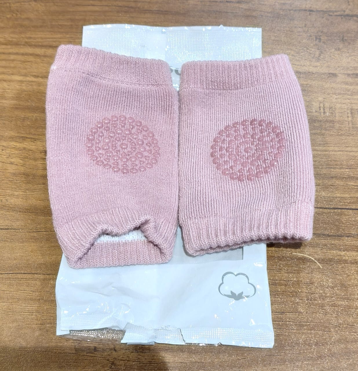 Pink toddler wool knit leg warmer and knee guard by Wukusy, soft and cozy baby care accessory for warmth and protection.