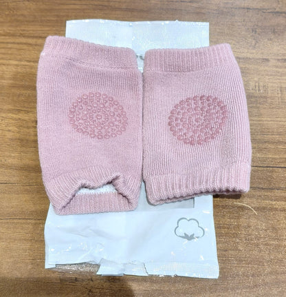 Pink toddler wool knit leg warmer and knee guard by Wukusy, soft and cozy baby care accessory for warmth and protection.