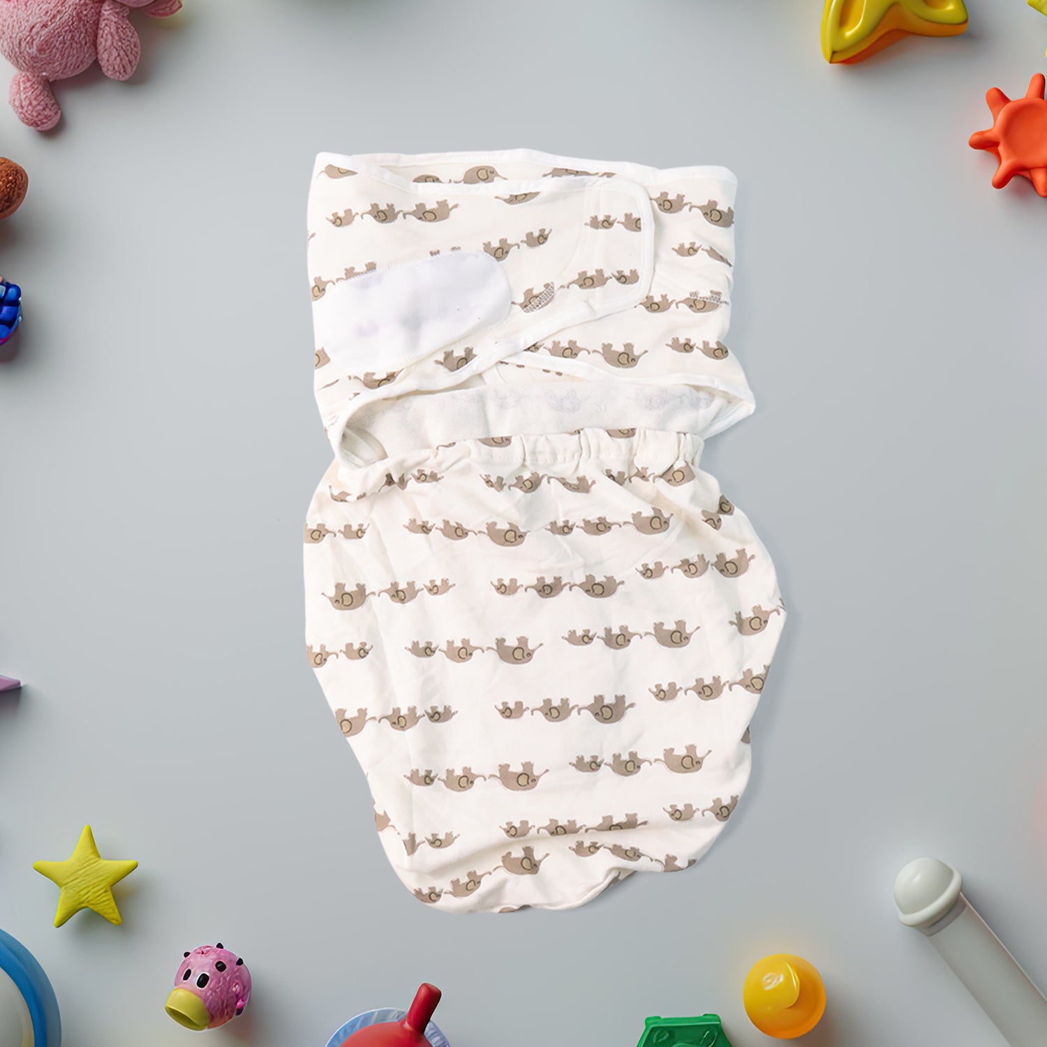 Soft cotton adjustable baby swaddle wrap by Wukusy for newborns, shown wrapped around a sleeping infant in a cozy setting.