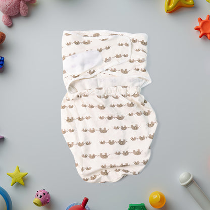 Soft cotton adjustable baby swaddle wrap by Wukusy for newborns, shown wrapped around a sleeping infant in a cozy setting.
