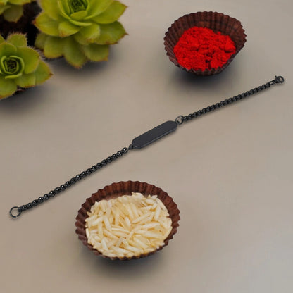 Black Rakhi gift bracelet by Wukusy, stylish black bracelet for Raksha Bandhan, featuring intricate design details.