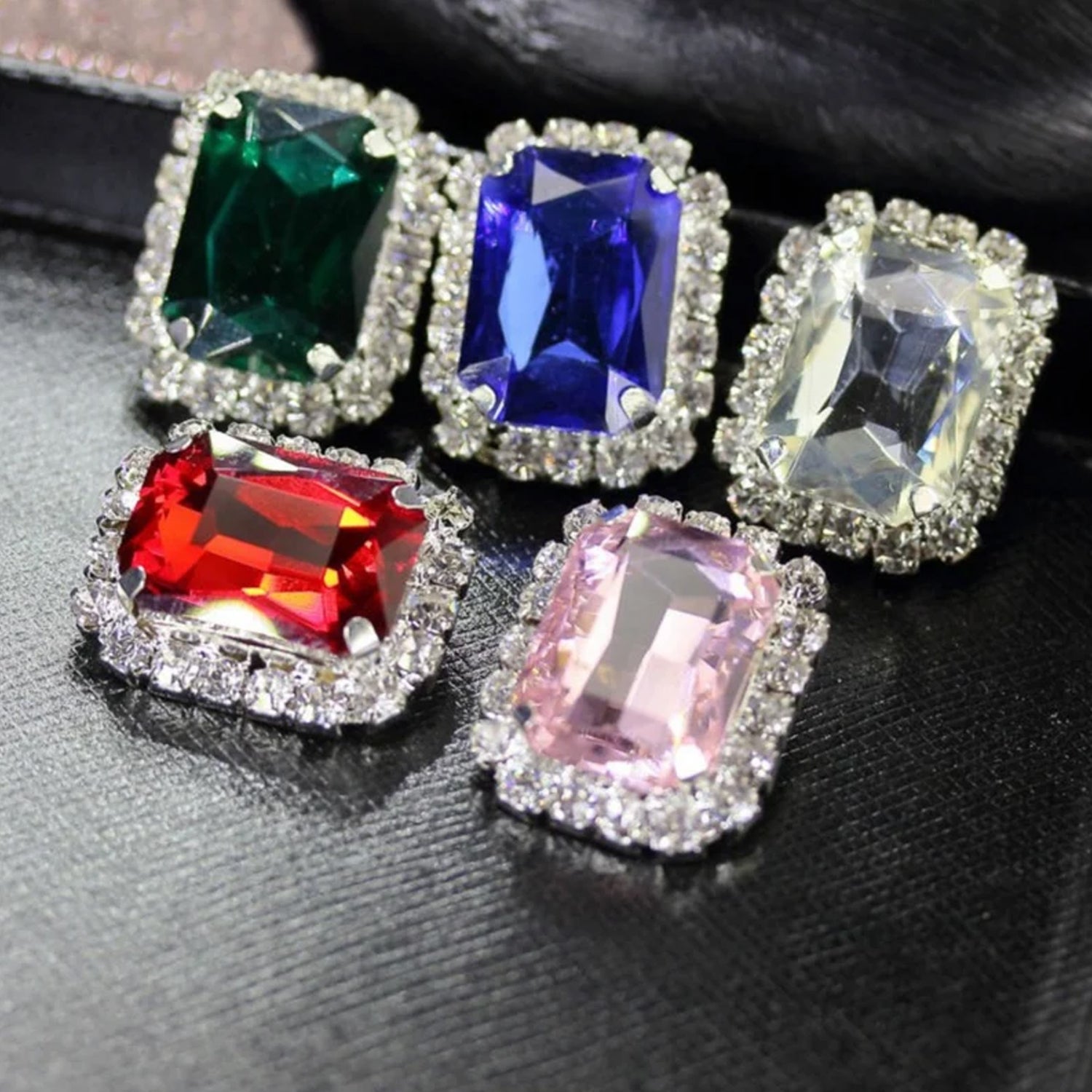 Wukusy diamond jewelry interchangeable triangular-shaped earrings with six pairs in mixed colors, displayed on a neutral background.