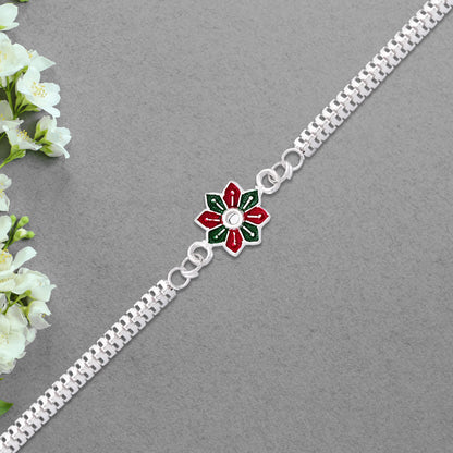Elegant bracelet-style Rakhi bracelet by Wukusy featuring intricate design and decorative elements on a neutral background.