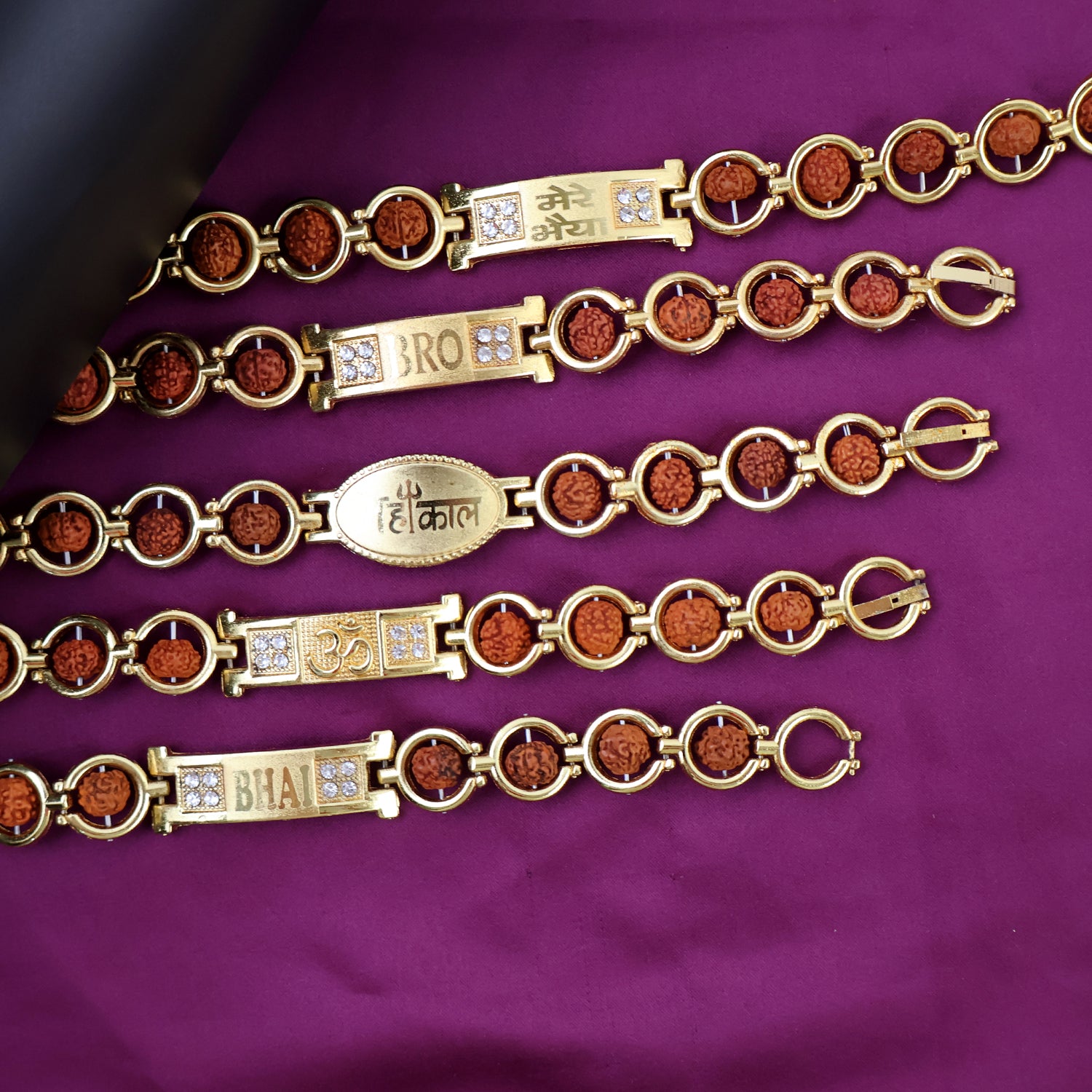 Gold plated designer circular bead bracelet for brother, Wukusy Rakhi, featuring mixed design, stylish jewelry for special occasions.
