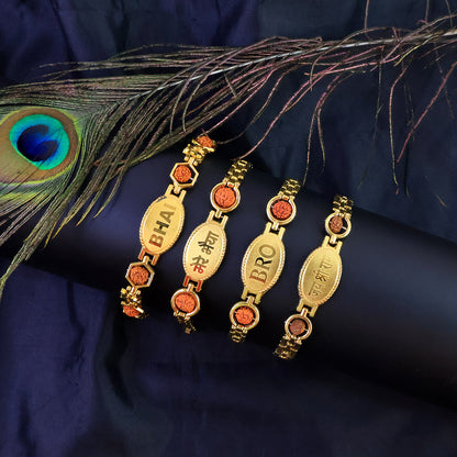 Gold plated metal bracelet rakhi for brother, stylish Wukusy bracelet with intricate design, ideal for festive celebrations.