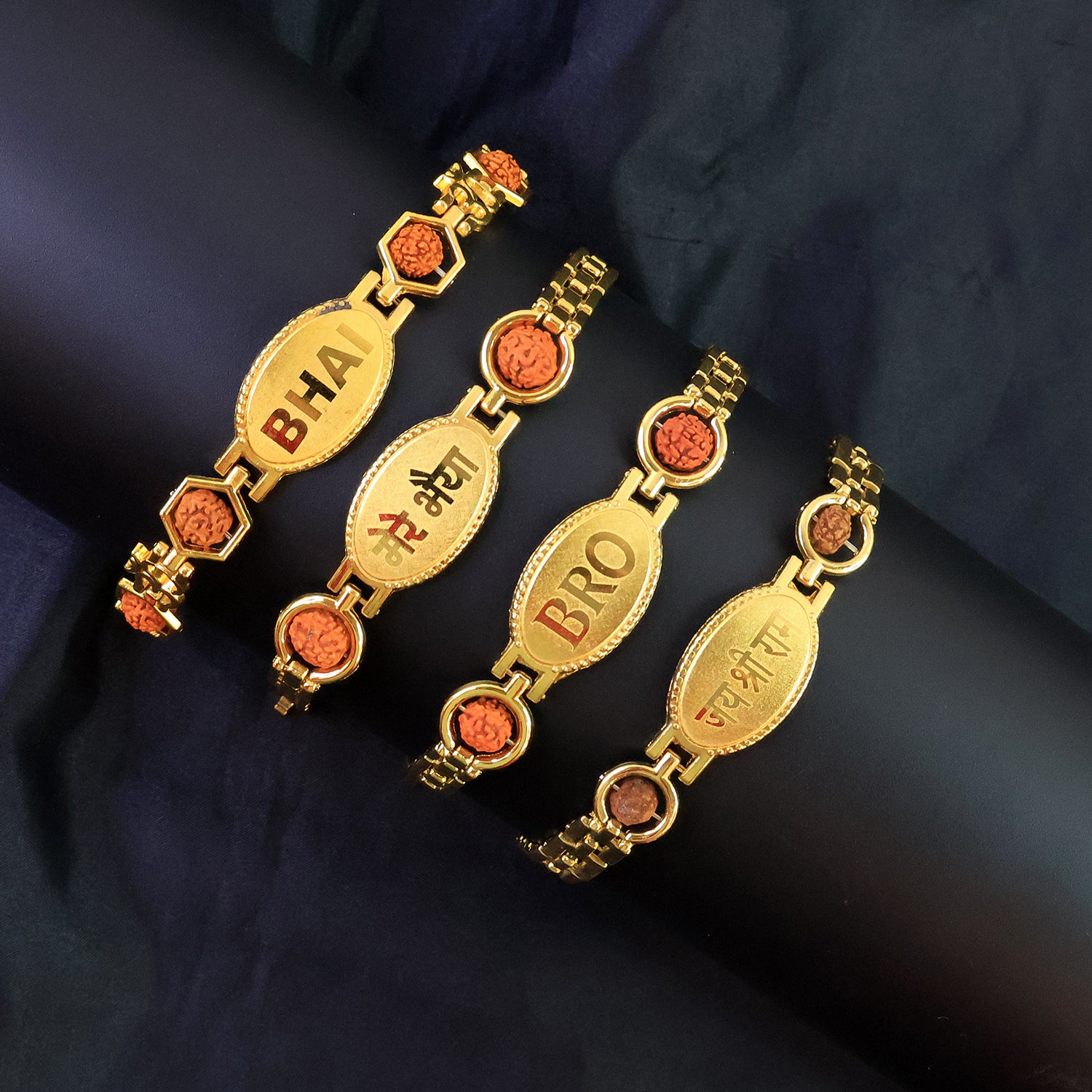 Gold plated metal bracelet rakhi for brother by Wukusy, featuring intricate design and traditional style.
