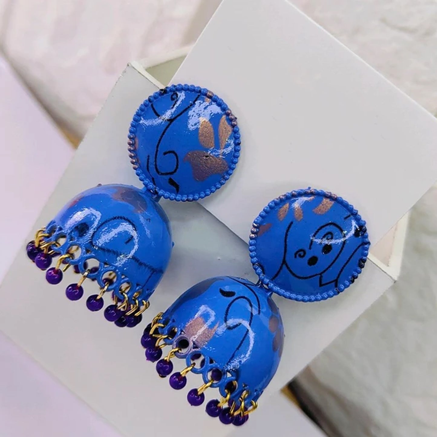 Colorful Wukusy jhumka earrings for women and girls, featuring traditional design and intricate craftsmanship.