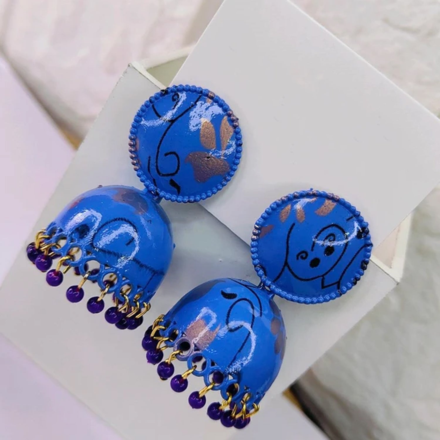 Colorful Wukusy jhumka earrings for women and girls, featuring traditional design and intricate craftsmanship.