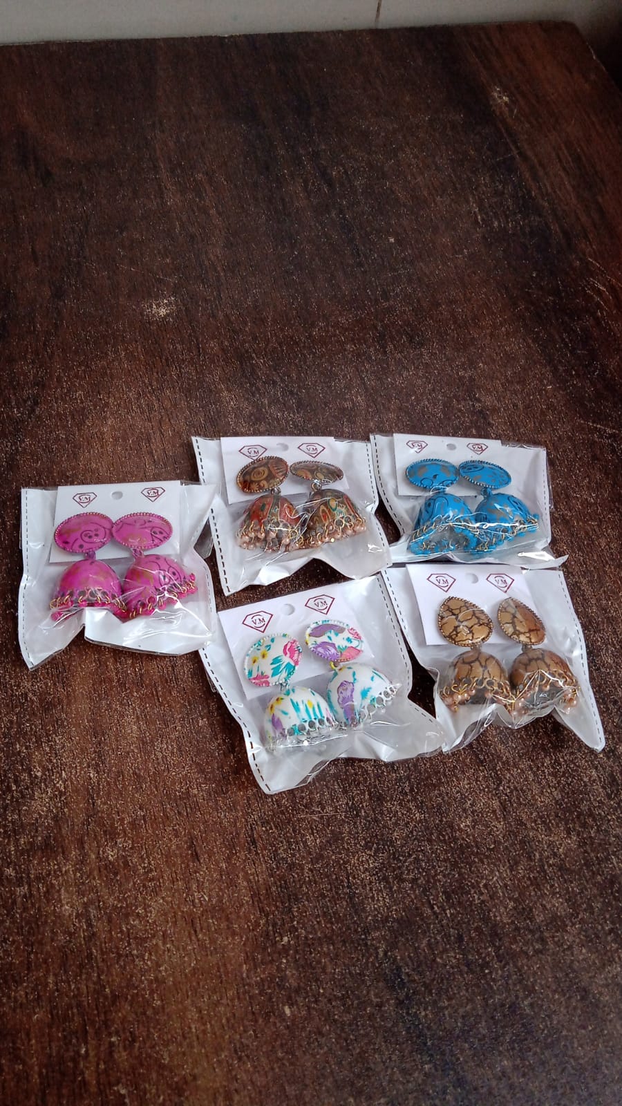 Colorful Wukusy jhumka earrings and buti design for women and girls, featuring traditional mixed color jewelry in a single pair.