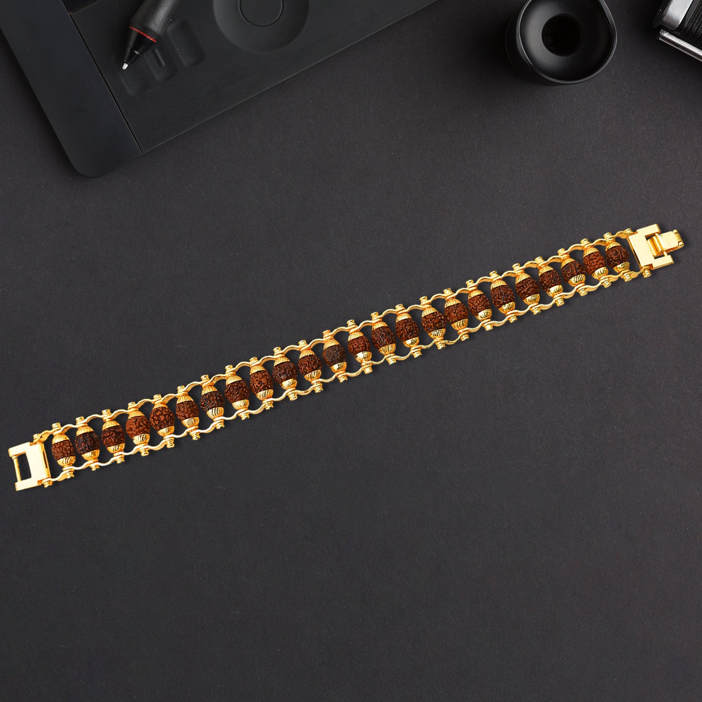 Golden Rudraksha bracelet Rakhi for brother, modern design by Wukusy, featuring authentic Rudraksha beads in a stylish bracelet.