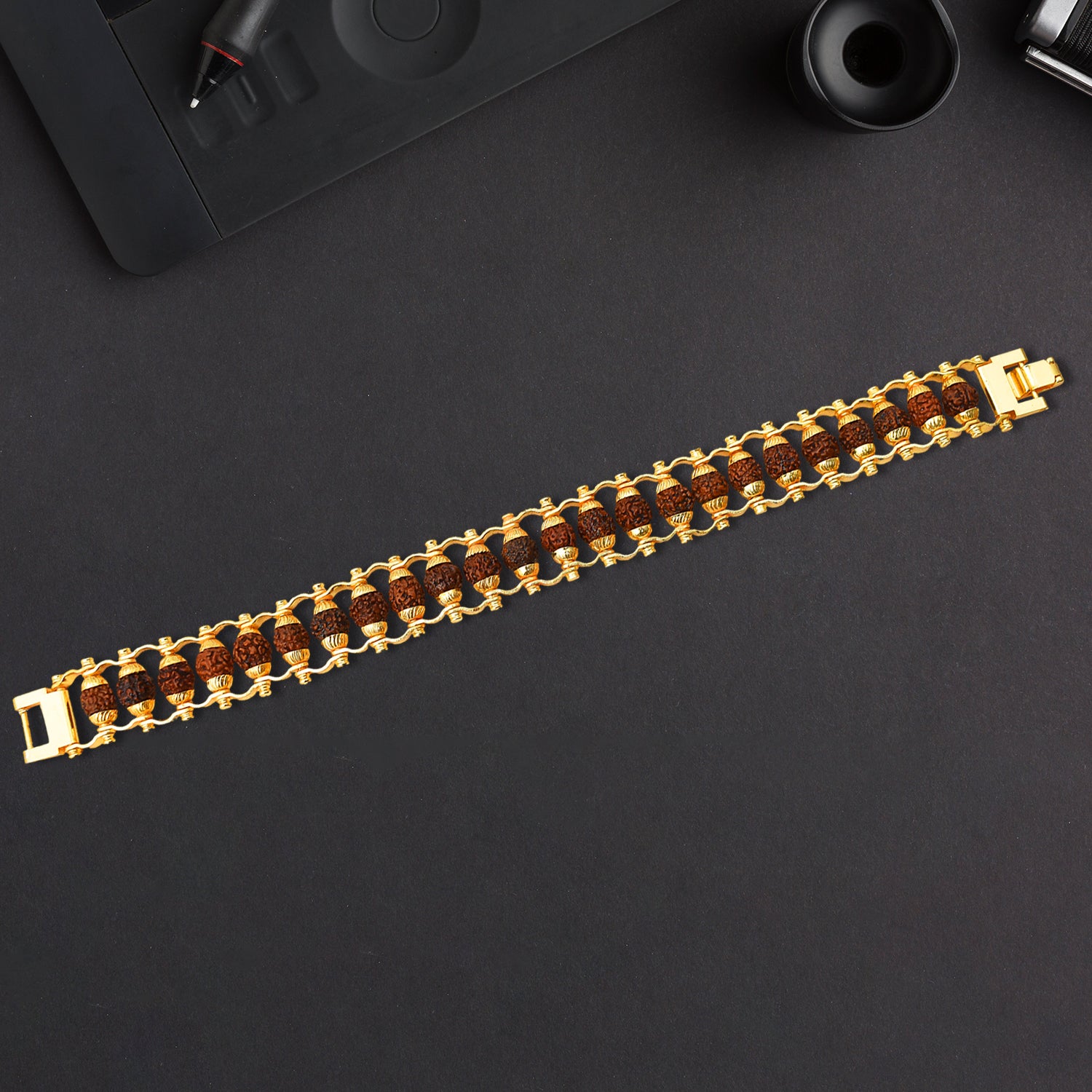 Golden Rudraksha bracelet Rakhi for brother, modern design by Wukusy, featuring authentic Rudraksha beads in a stylish bracelet.