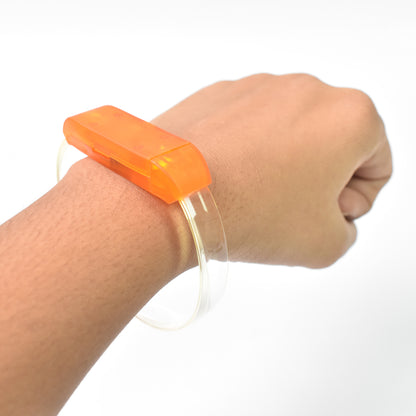 Wukusy multicolor LED running bracelet for runners, lightweight and adjustable, visible in a close-up shot.