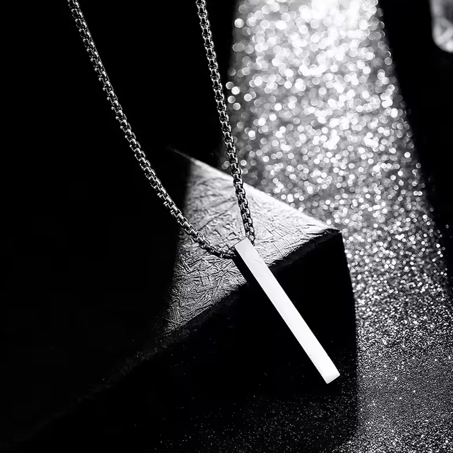 Stainless steel plain stick-shaped locket bracelet with chain by Wukusy, featuring a sleek minimalist design and adjustable chain.