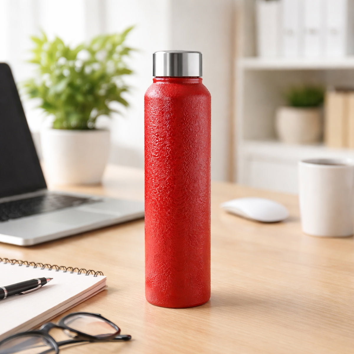 Red 1000ml stainless steel water bottle by Wukusy, with a sleek design and secure lid for reusable hydration.
