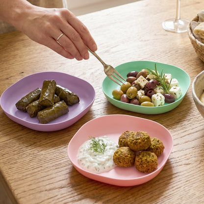 Wukusy 11-in-1 multipurpose plastic snack serving tray with multiple compartments, ideal for snacks and appetizers.
