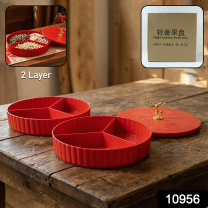 Wukusy 2-layer decorative dry fruit and snack serving tray with multiple compartments, used for serving dry fruits and snacks.