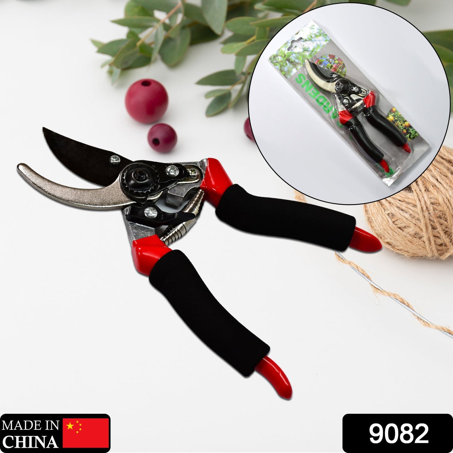 Red 21cm garden shears by Wukusy with sharp blades for pruning and cutting plants or branches in the garden.