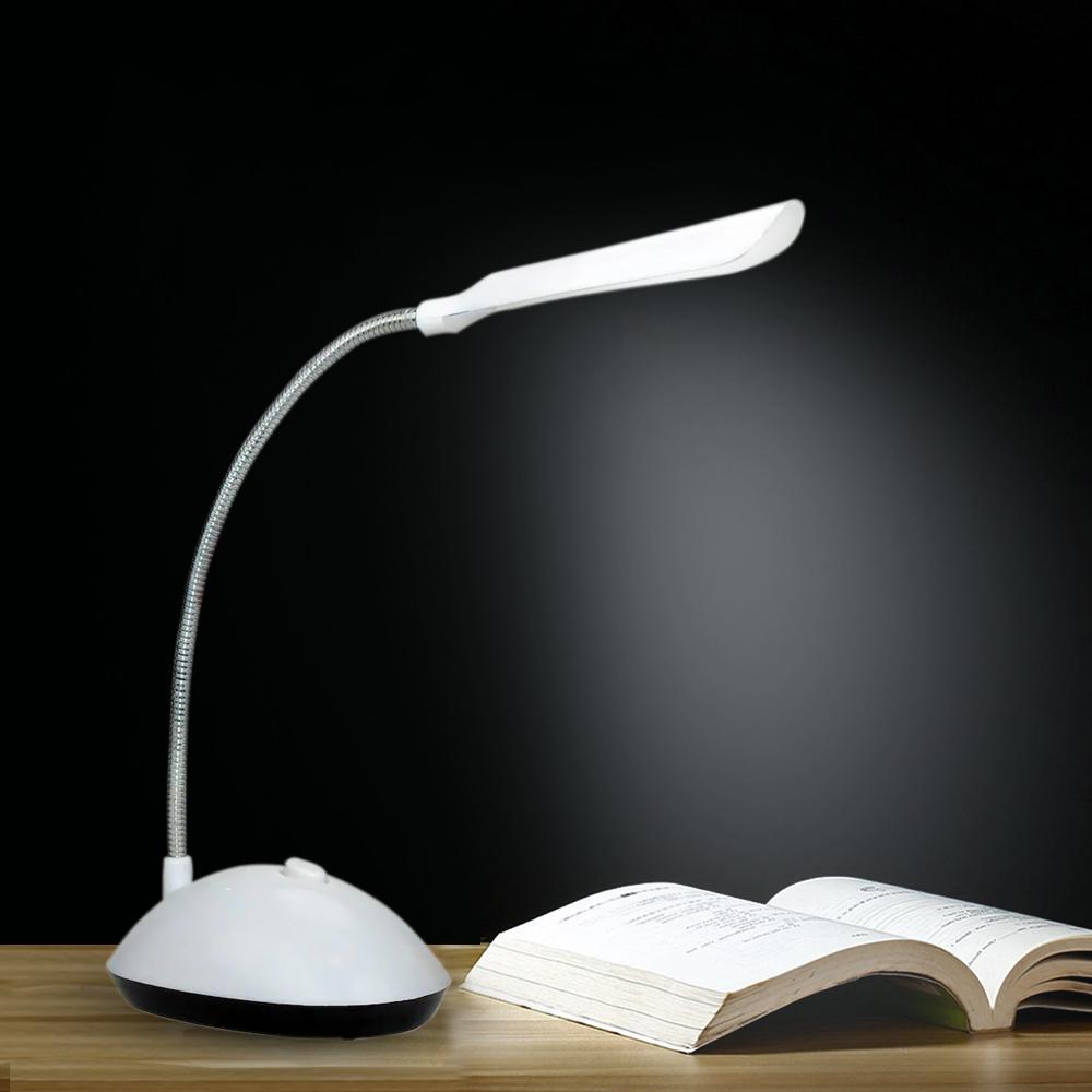 Wukusy 255 portable LED reading light with adjustable brightness and touch control desk lamp on a desk.