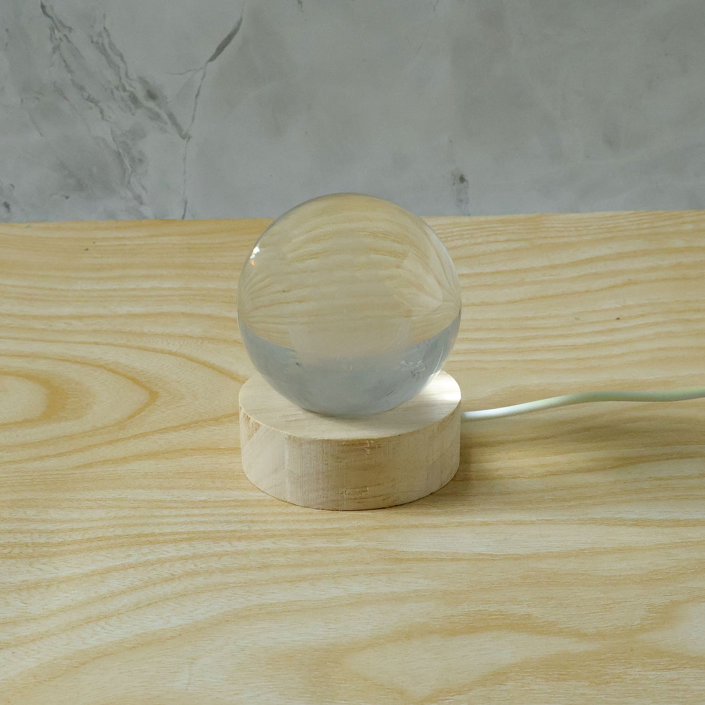 3D crystal Lakshmi ball LED night lamp with wooden base by Wukusy, featuring intricate Lakshmi design and soft glow illumination.