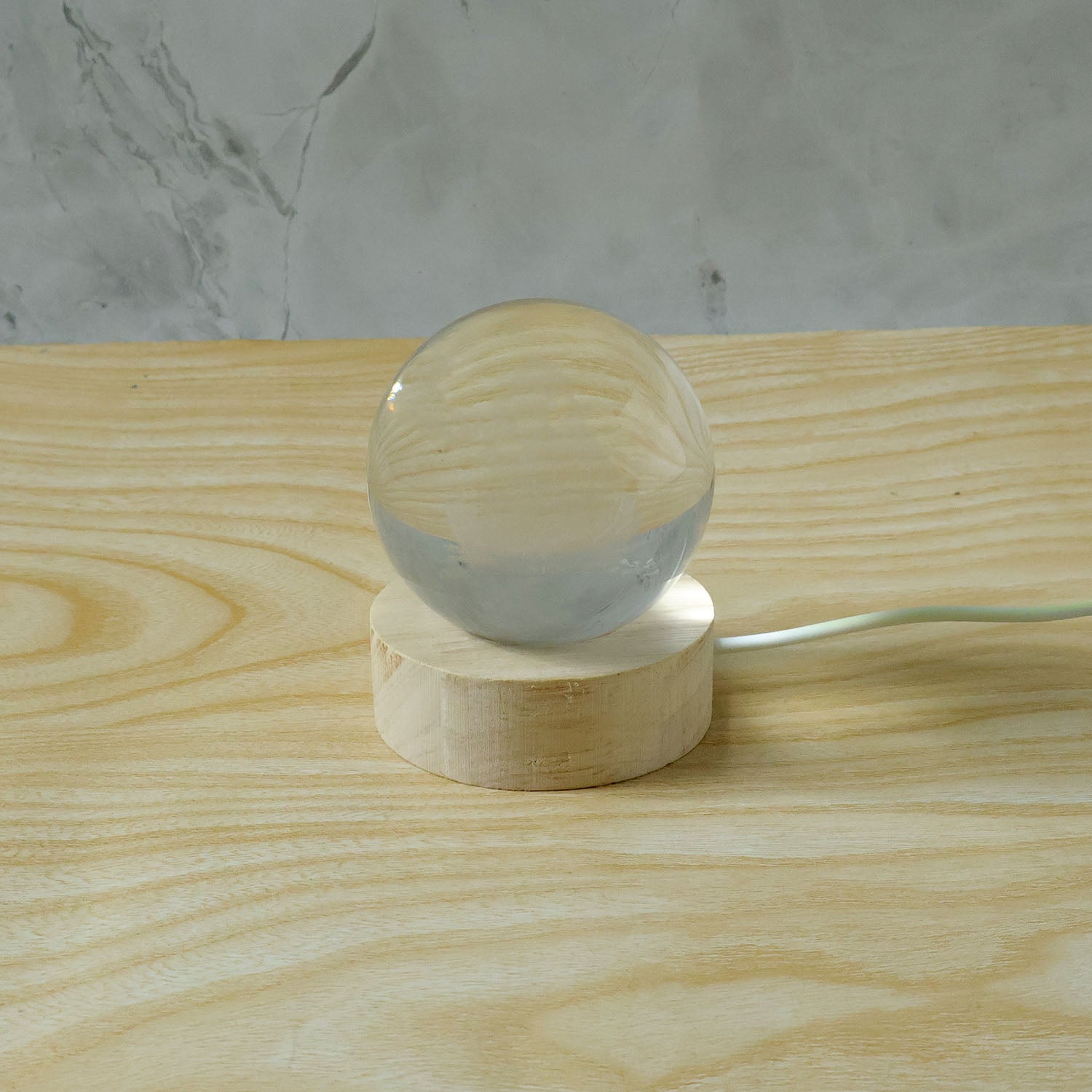 3D crystal Lakshmi ball LED night lamp with wooden base by Wukusy, featuring intricate Lakshmi design and soft glow illumination.