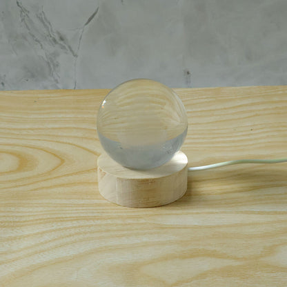 3D crystal Lakshmi ball LED night lamp with wooden base by Wukusy, featuring intricate Lakshmi design and soft glow illumination.