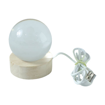 3D crystal Lakshmi ball LED night lamp on wooden base by Wukusy, illuminated with intricate Lakshmi design for a decorative glow.