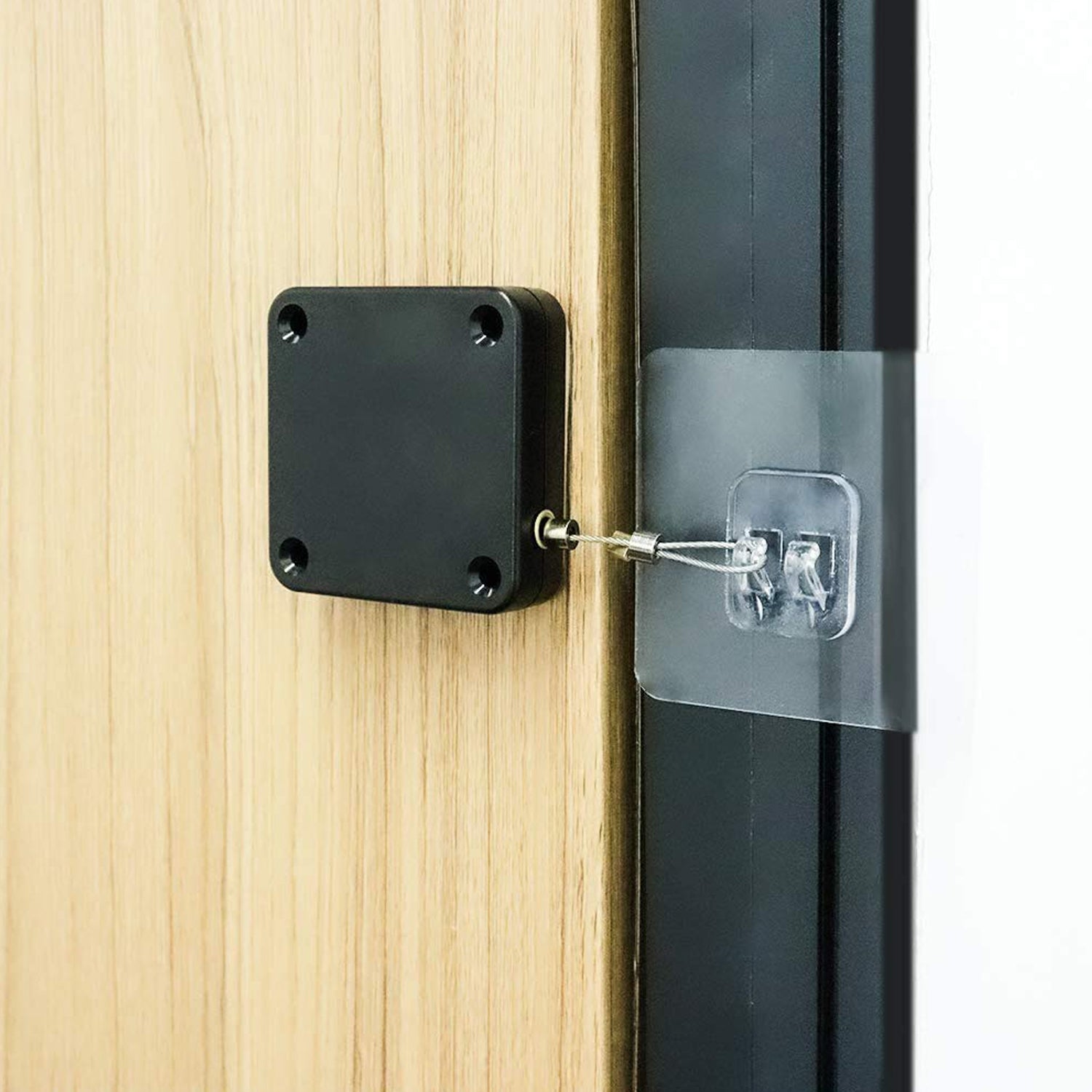 Wukusy punch-free automatic sensor door closer installed on a door, demonstrating hands-free door closing technology.